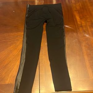 Super cute, black leggings with faux leather border 95% polyester, 5% spandex